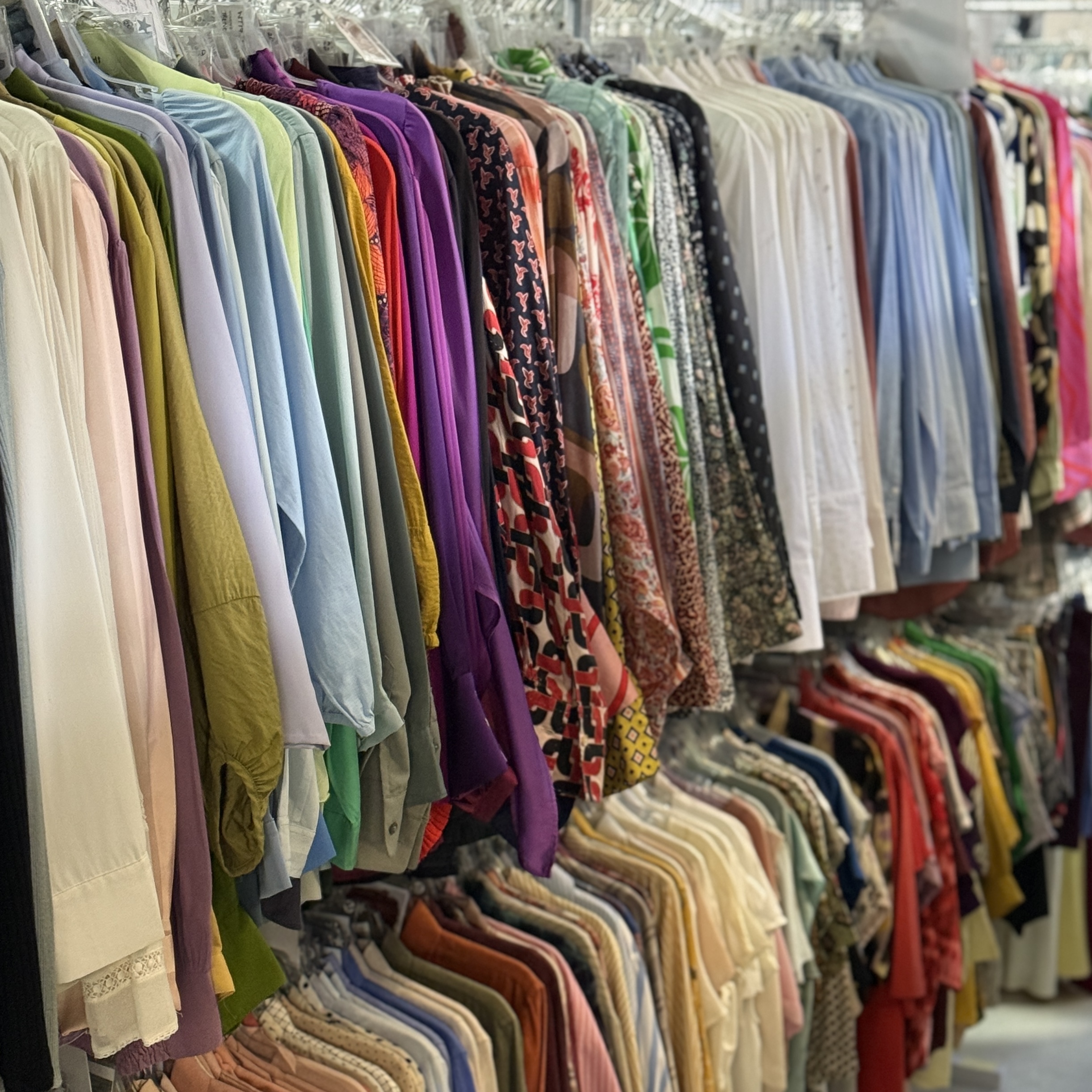Professional wardrobe rail filled with curated garments